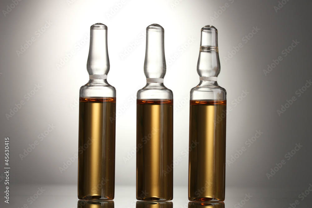 medical ampules on grey background medical ampules on grey background