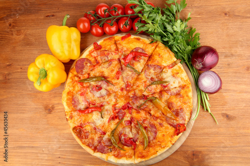 Tasty pepperoni pizza with vegetables