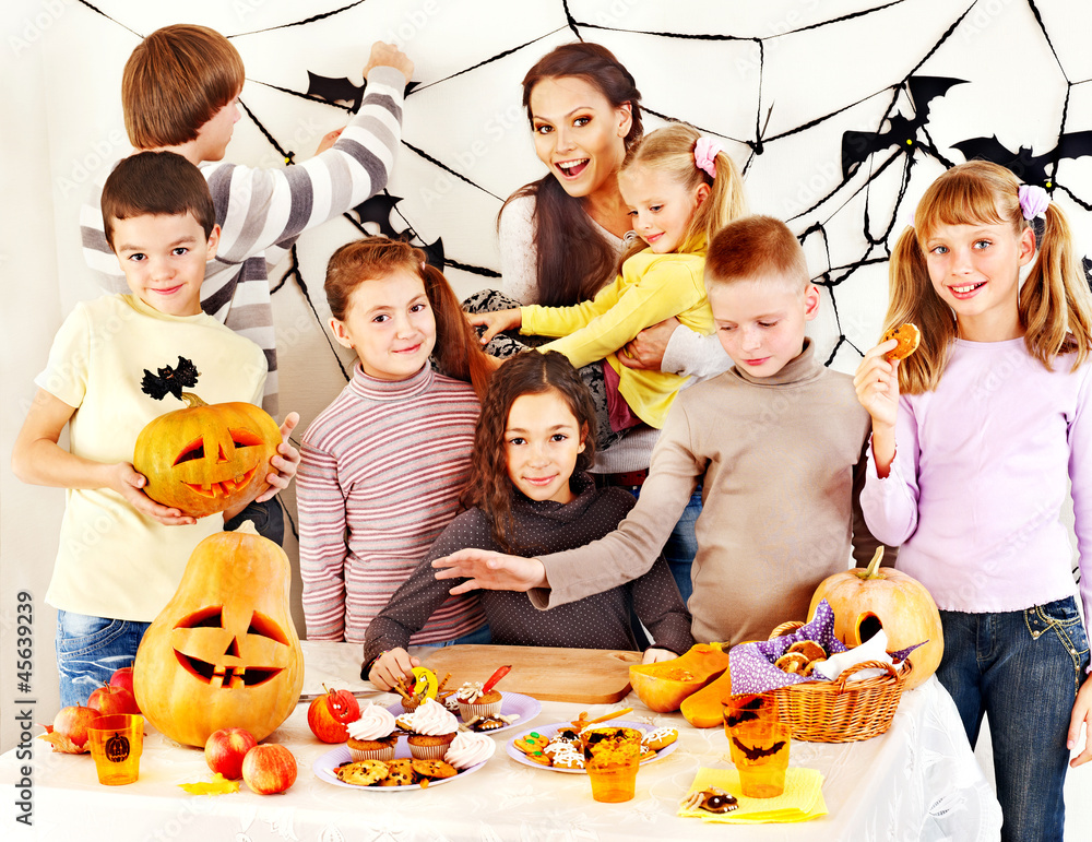 Family on Halloween party with children. Family on Halloween party with children.