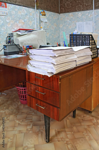 heap of the papers on table in office