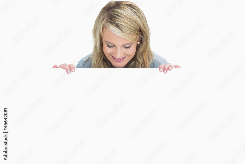 Woman holding a notice Woman holding a notice