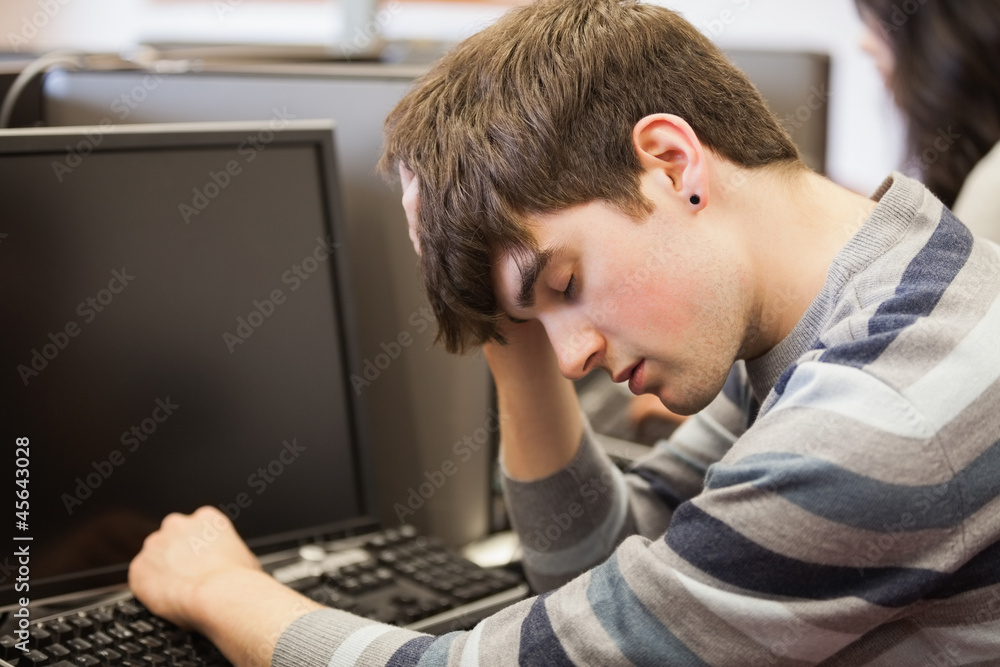Student sleeping at the computer Student sleeping at the computer