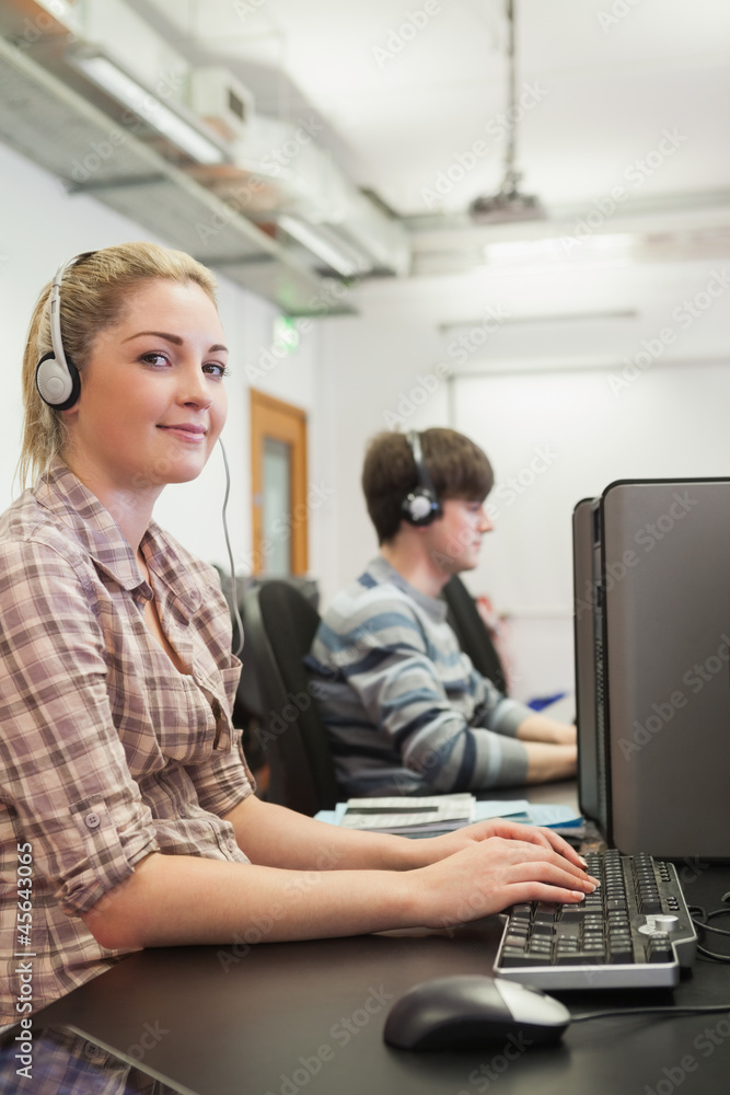 Woman working in computer class Woman working in computer class