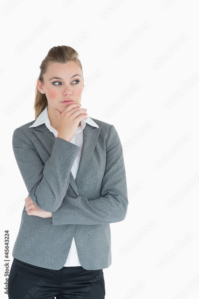 Businesswoman looking away in thought Businesswoman looking away in thought