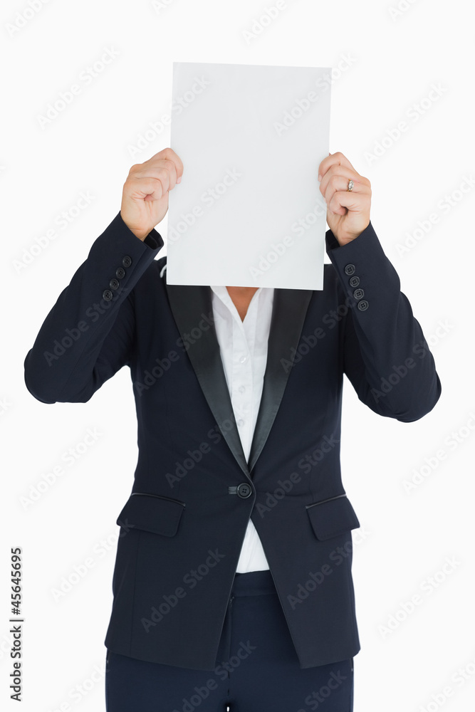Business woman holding a white panel in front of her face Business woman holding a white panel in front of her face