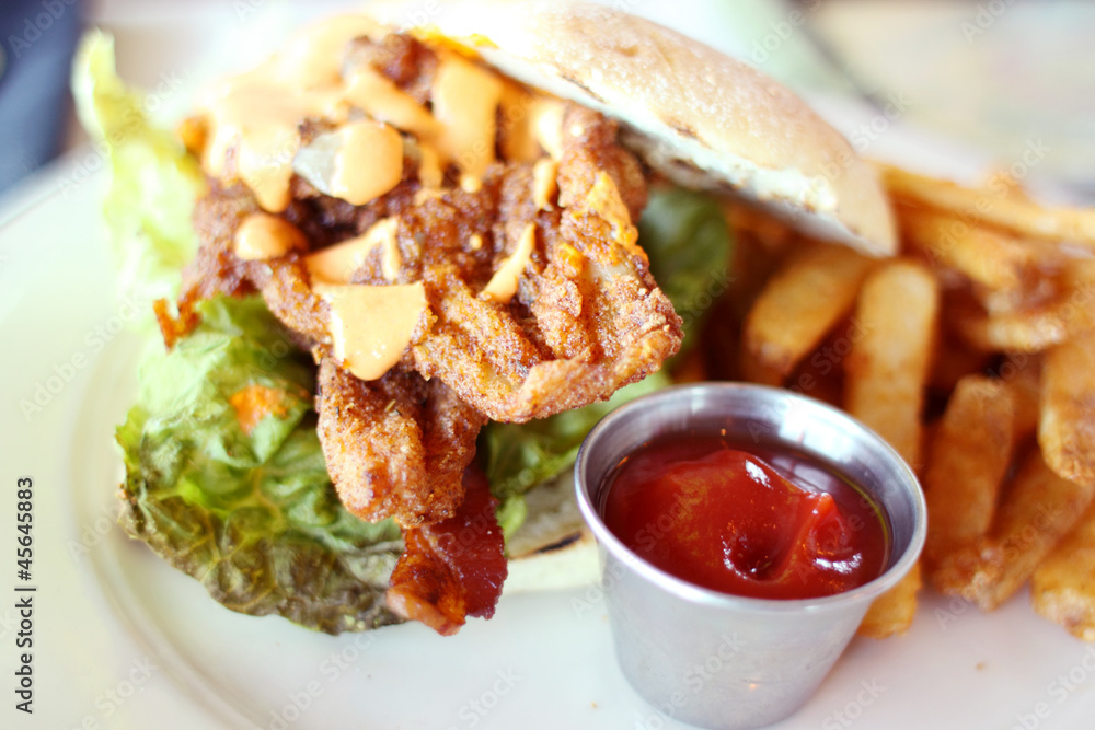 Breaded razor clam sandwich with french fries. Breaded razor clam sandwich with french fries.