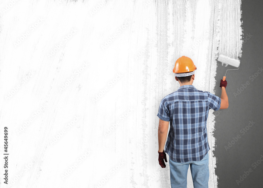 man decorating or painting house man decorating or painting house