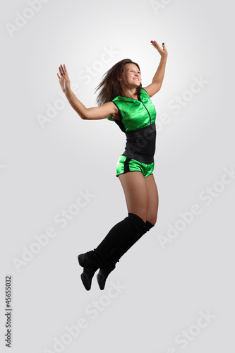 Young female dancer against white background