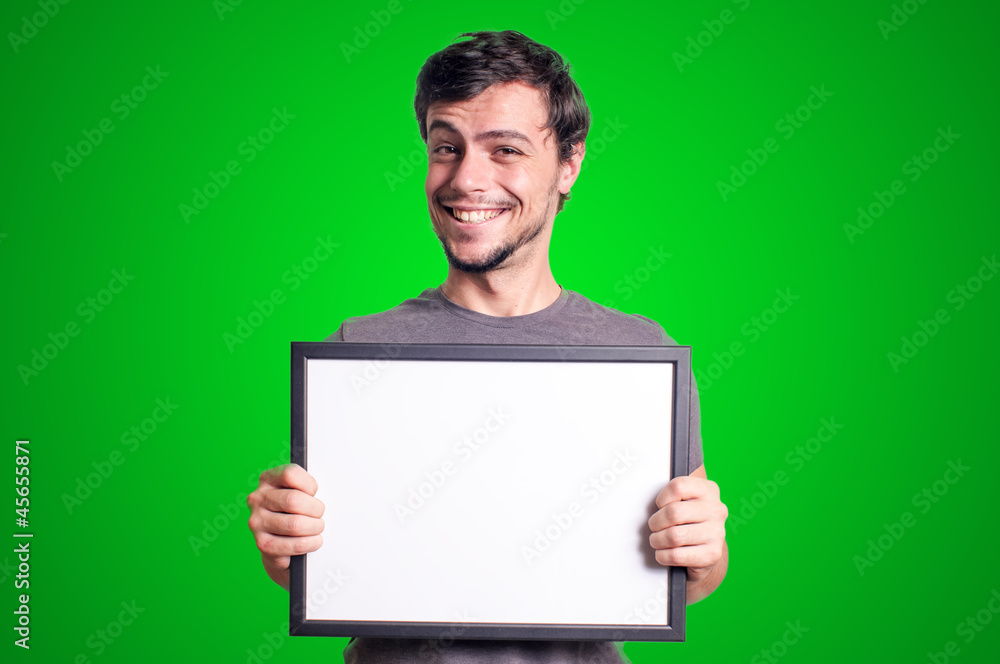 smiling guy holding empty board smiling guy holding empty board