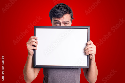 guy holding blank empty board