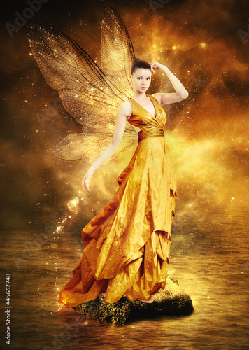 Magical young woman as golden fairy