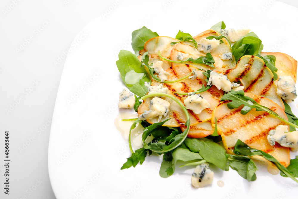 Salad with grilled pears, arugula and blue cheese Salad with grilled pears, arugula and blue cheese