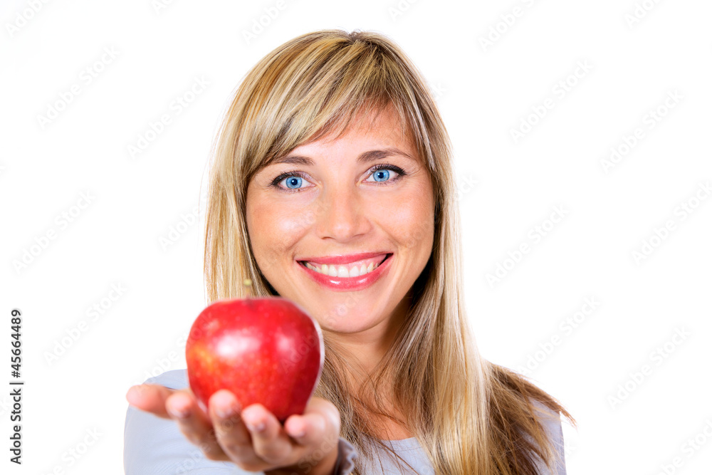 Smiling woman giving you an apple isolated on white Smiling woman giving you an apple isolated on white