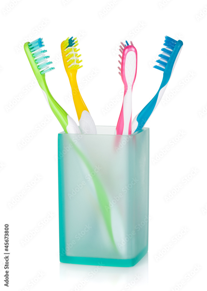 Four multicolored toothbrushes Four multicolored toothbrushes