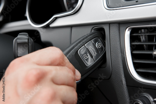 Hand inserting hightech car key