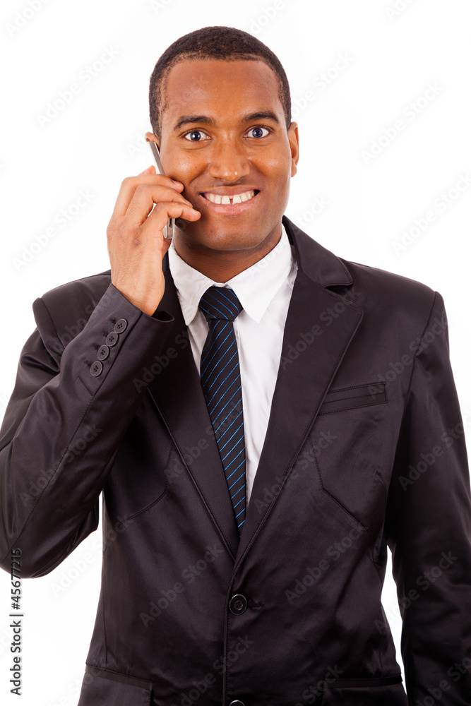 Portrait of a African young business man on the phone, isolated Portrait of a African young business man on the phone, isolated