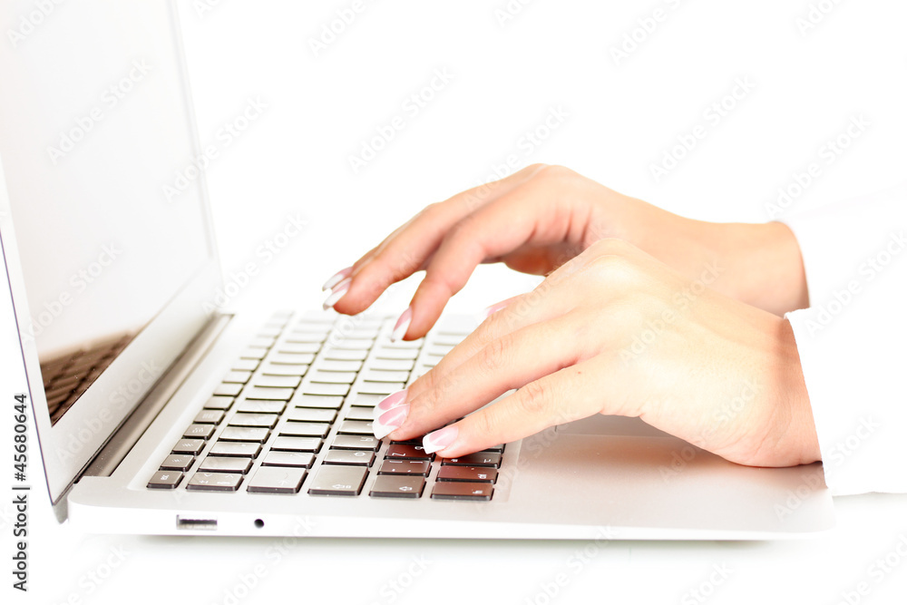 Hands typing on laptop keyboard close up Hands typing on laptop keyboard close up