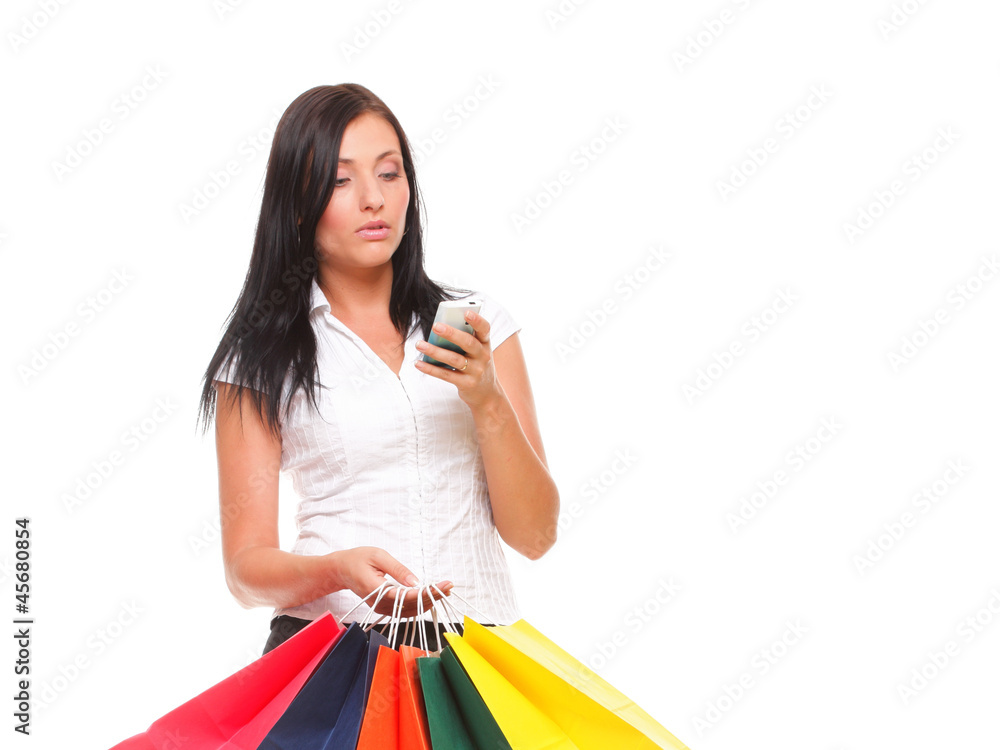 portrait cute young woman mobile phone while holding shopping ba portrait cute young woman mobile phone while holding shopping ba
