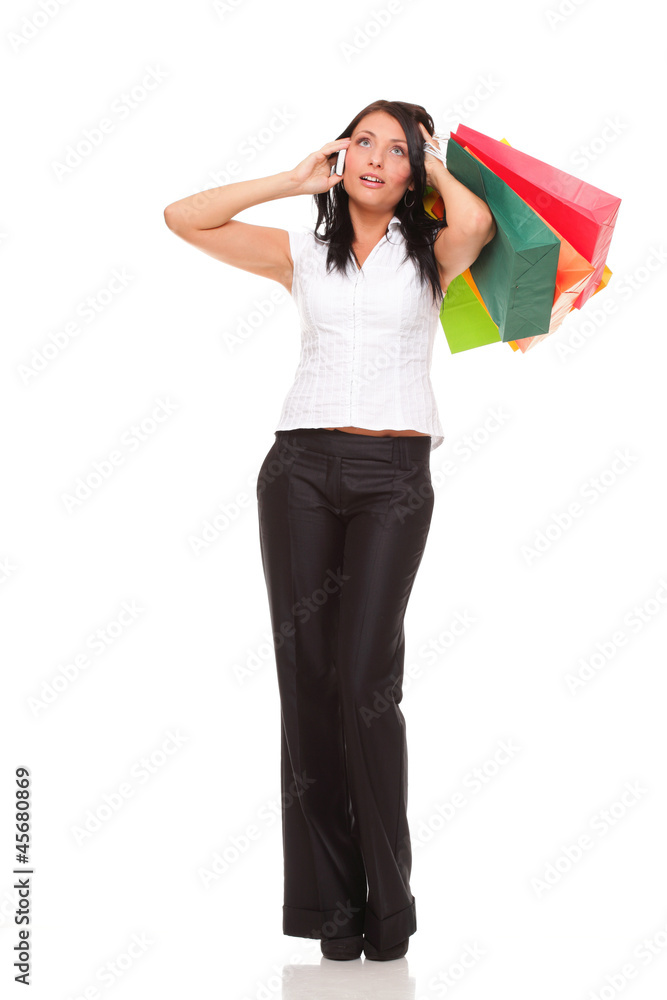 portrait cute young woman mobile phone while holding shopping ba portrait cute young woman mobile phone while holding shopping ba