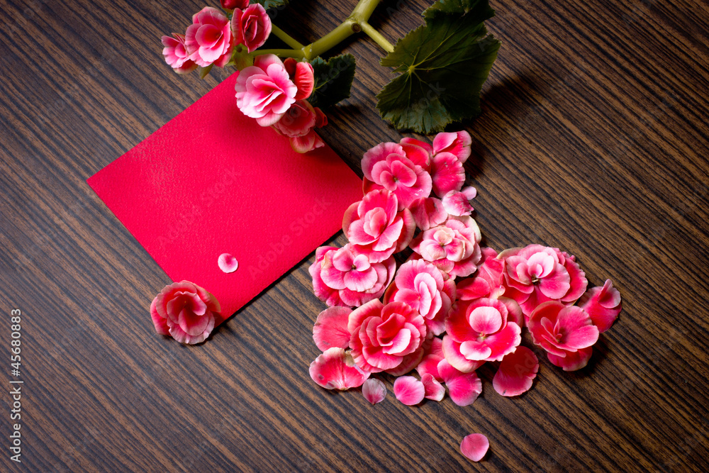 Heart of petal from flowers on wooden table Heart of petal from flowers on wooden table