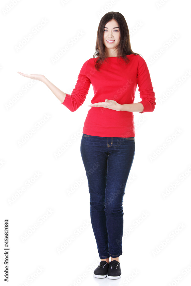 Young woman showing copy space Young woman showing copy space