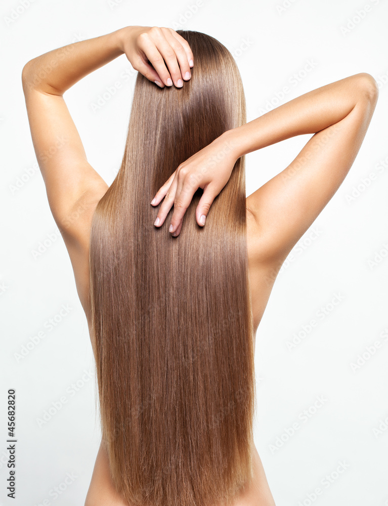 Naklejka premium Portrait of young woman with long hair