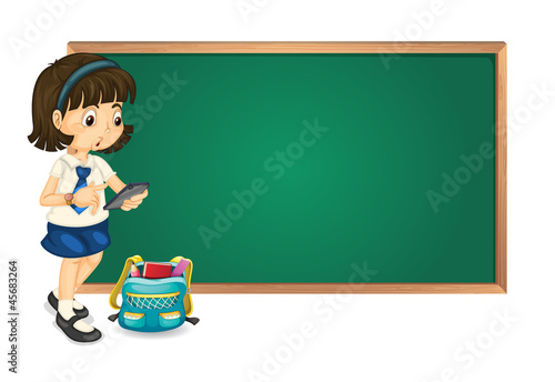 a girl and a green board