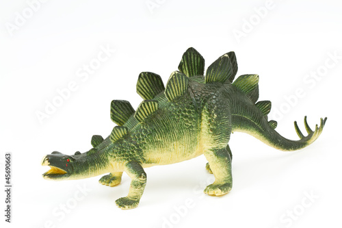 Toy plastic dinosaur on white baclground © noomhh