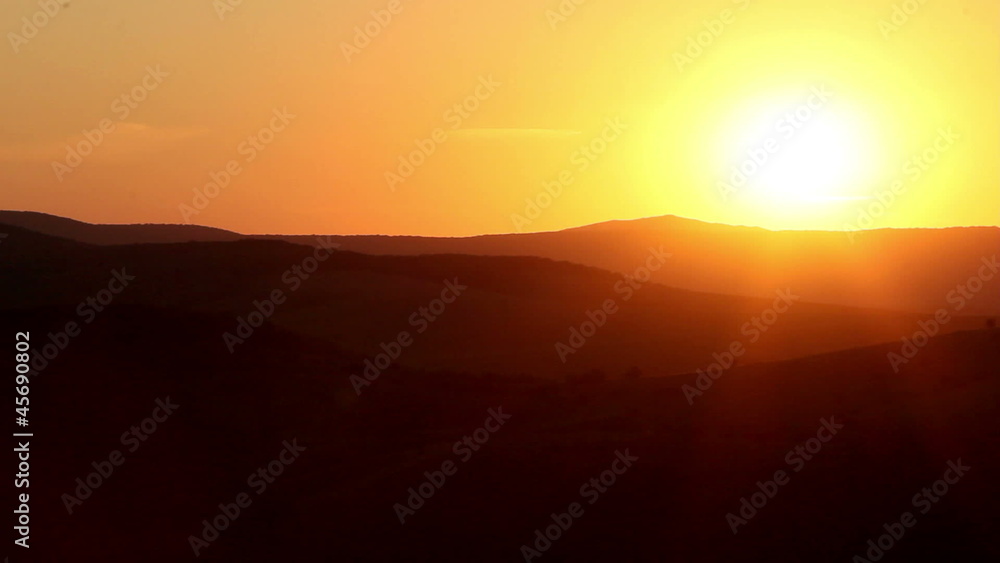 Silhouetted hills at sunset Silhouetted hills at sunset
