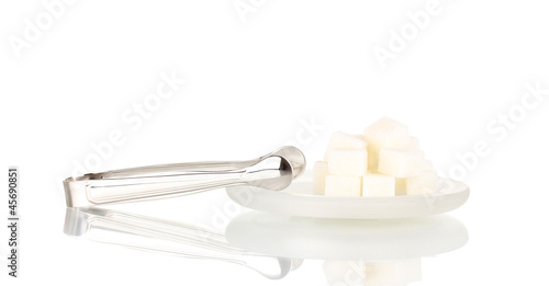 Sugar cubes in saucer isolated on white