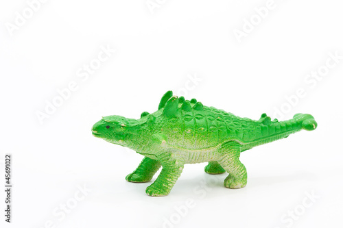 Toy plastic dinosaur on white baclground