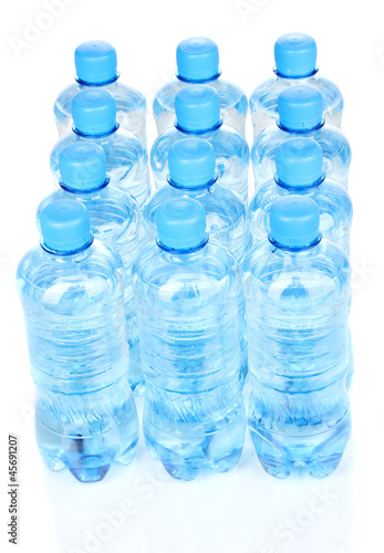plastic bottles of water isolated on white