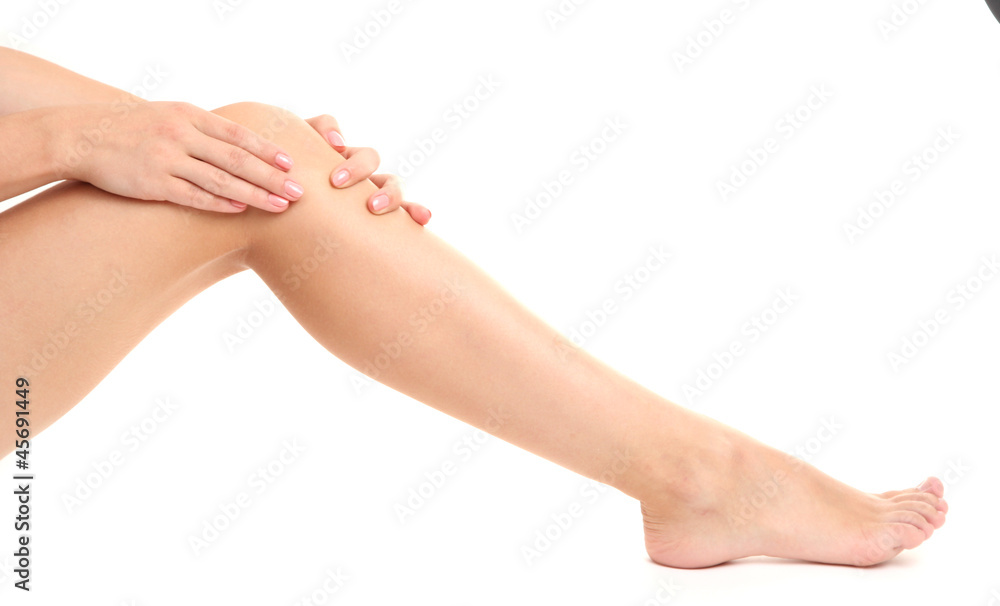 woman holding sore leg, isolated on white woman holding sore leg, isolated on white