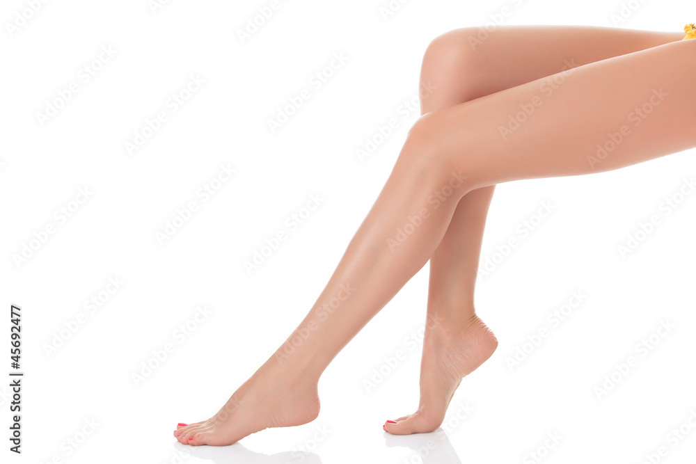 Long female legs after depilation, isolated on white background Long female legs after depilation, isolated on white background