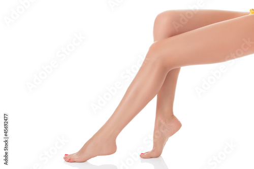 Long female legs after depilation, isolated on white background