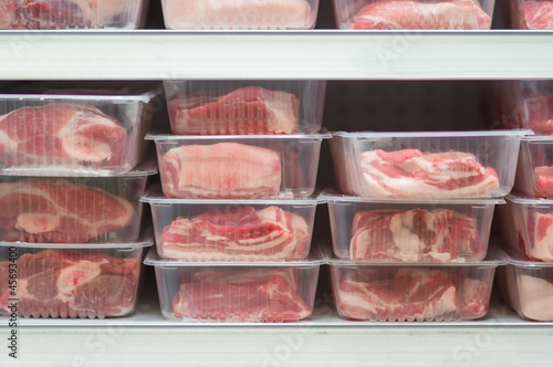 Pork meat in plastic boxes in supermarket
