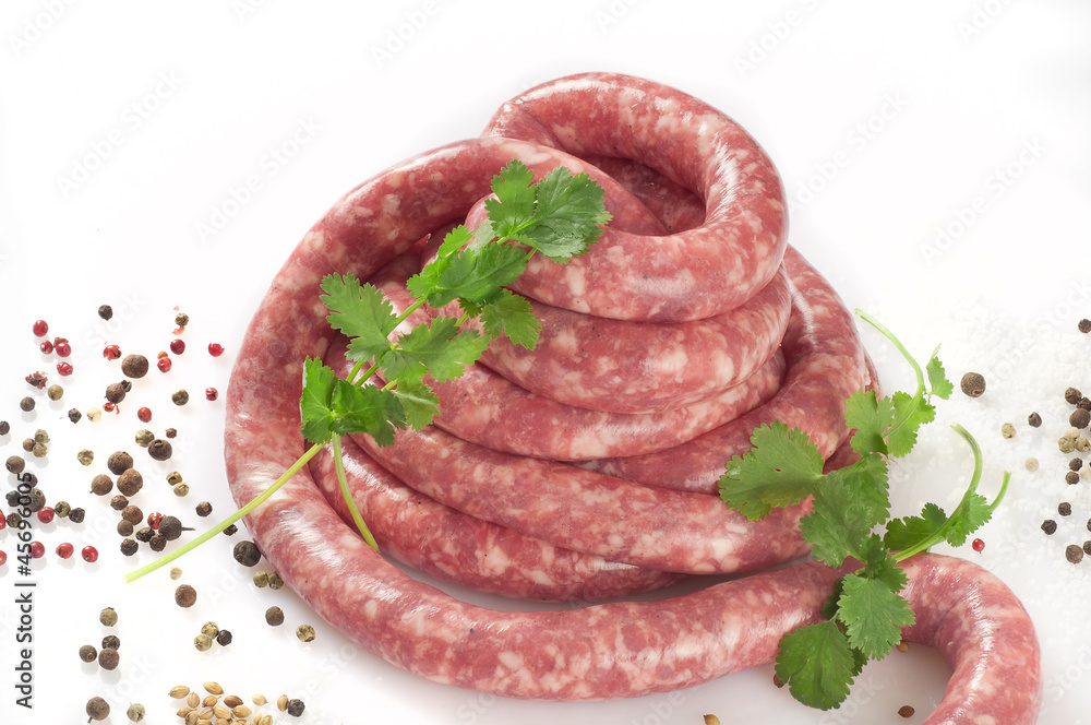 a natural raw sausage on white