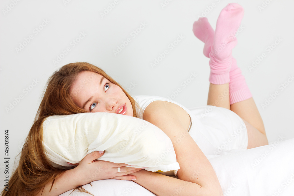 pretty happy girl on the bed at home pretty happy girl on the bed at home