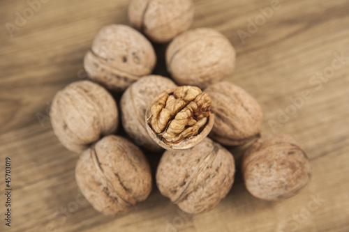 Walnuts on brown wood