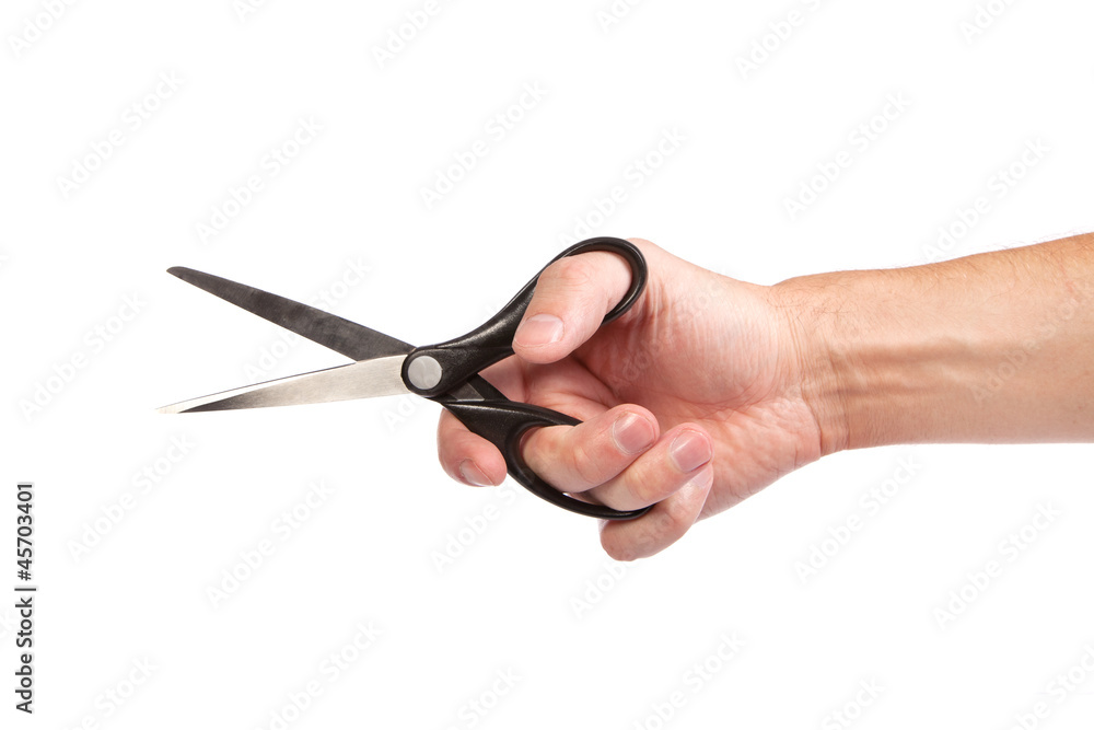 Hand is holding scissors isolated Hand is holding scissors isolated