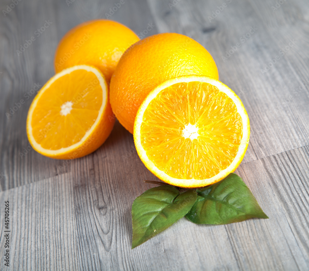 Fresh oranges on wooden table Fresh oranges on wooden table