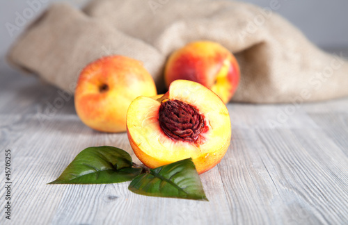 Fresh nectarines on wooden table 