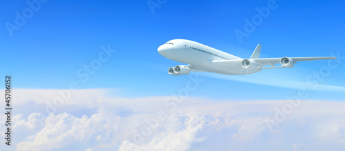 White passenger plane in the blue sky © Sergey Nivens