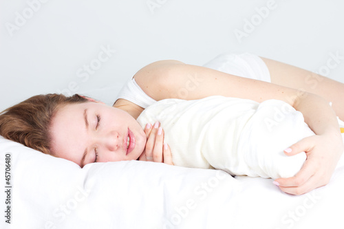 pretty girl on the bed at home photo