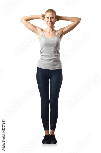 Woman doing exercises on white © Elnur