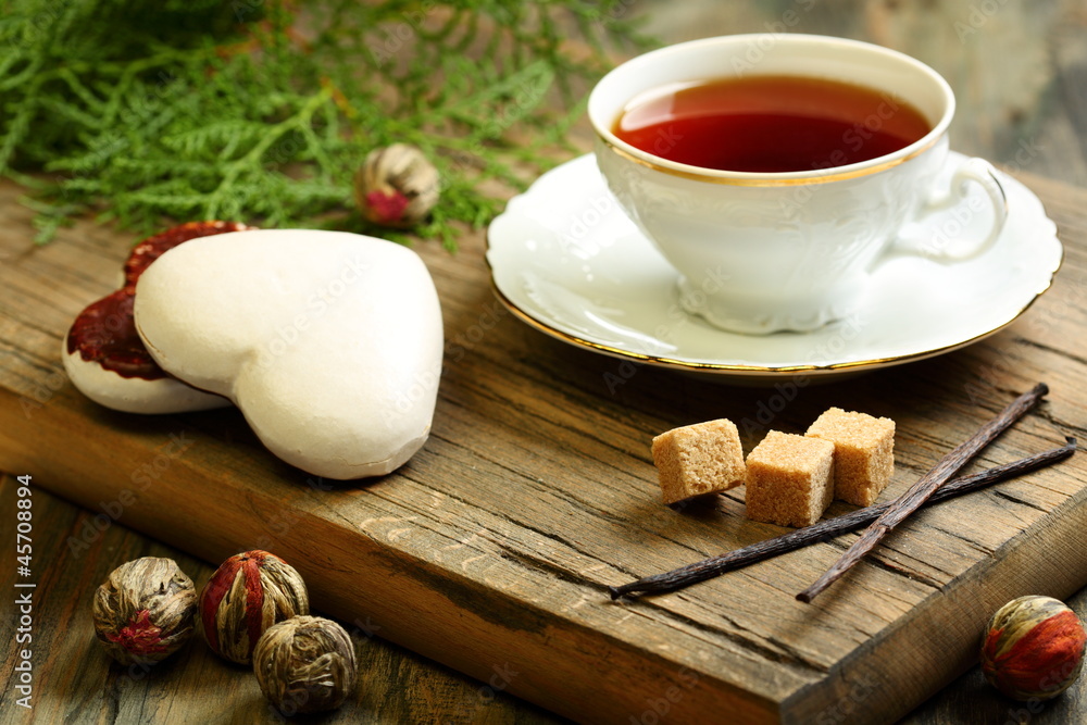 Spiced tea and ginger biscuits. Spiced tea and ginger biscuits.