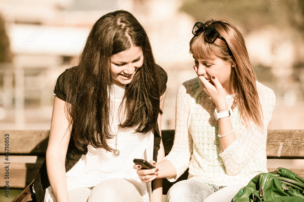 Two Young Women with Mobile Phone Two Young Women with Mobile Phone