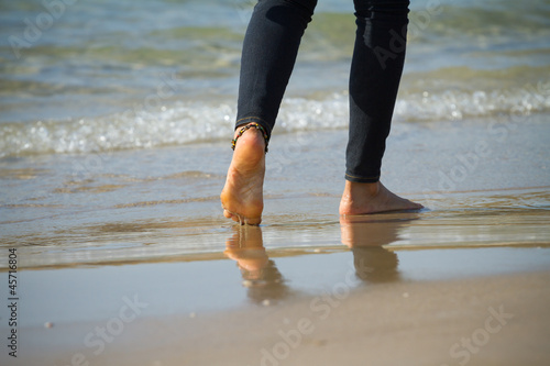 Walking on the sand © PhotoSerg