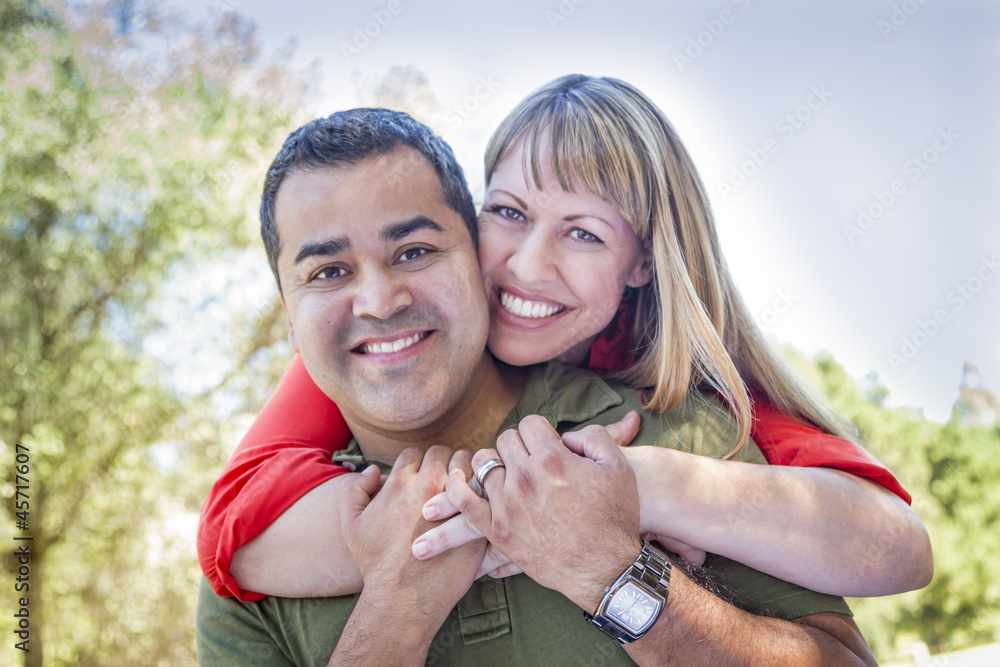 Fototapeta premium Attractive Mixed Race Couple Piggyback at the Park