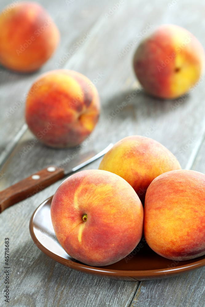 Peaches on a wooden table Peaches on a wooden table